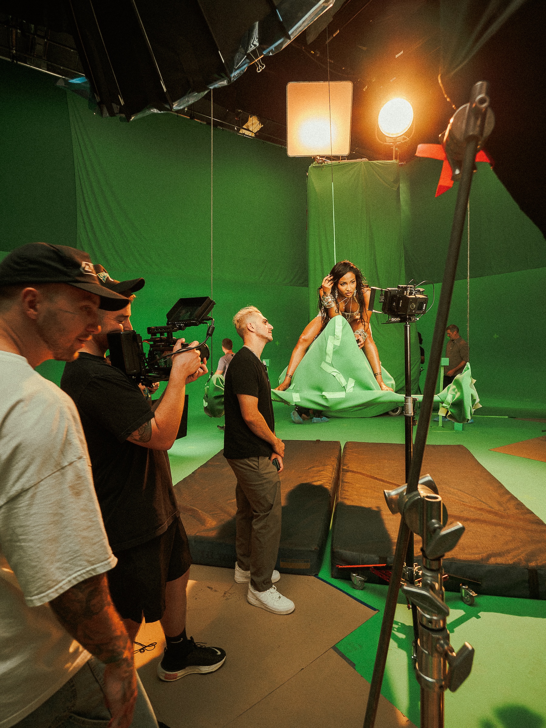Crew and camera on a green-screen stage
